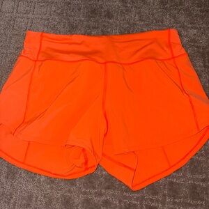 Womens lululemon 4in speed up shorts in size 6 orange